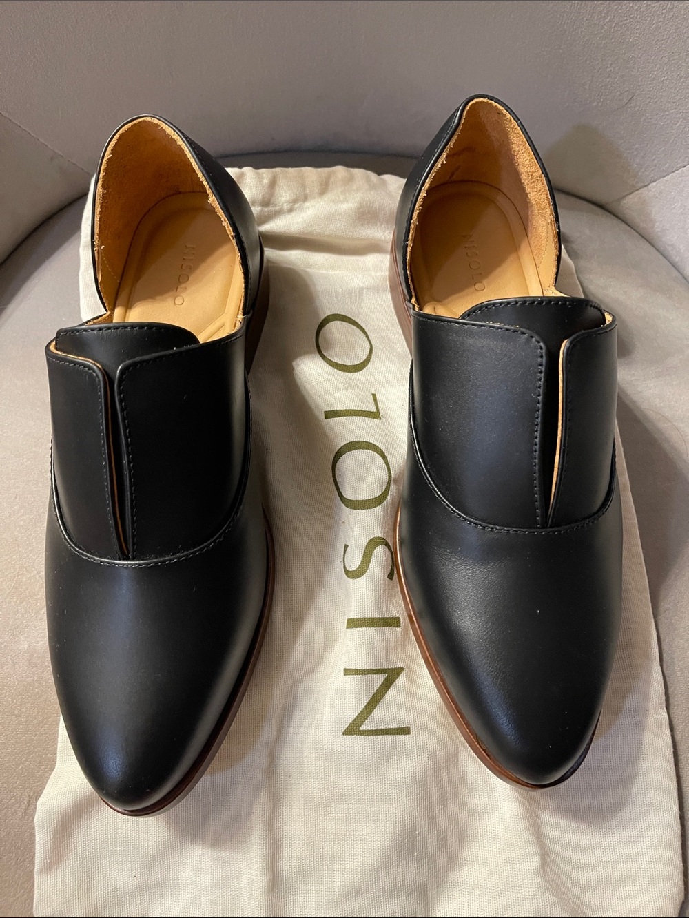 Nisolo Women’s black Leather Slip-On Loafers with Tan Trim